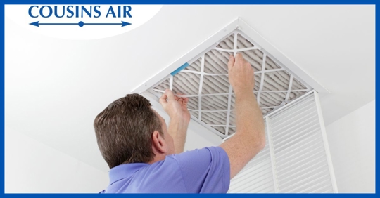 man replacing air filter