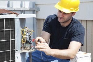 Man working on an HVAC Unit