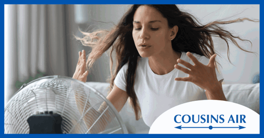 Woman in front of fan